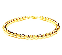 18k gold bead bracelet - 6mm.  Made with medium weight hard-wall beads for extra durability.  Bracelet for women and men.